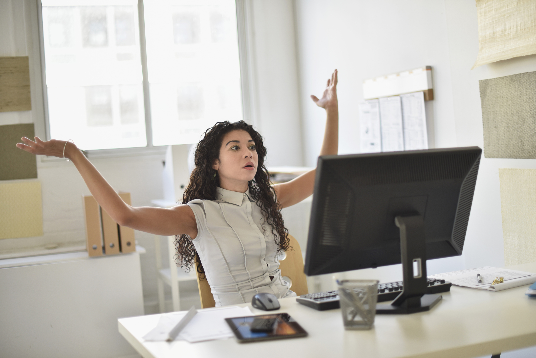 woman business owner frustrated at her desktop