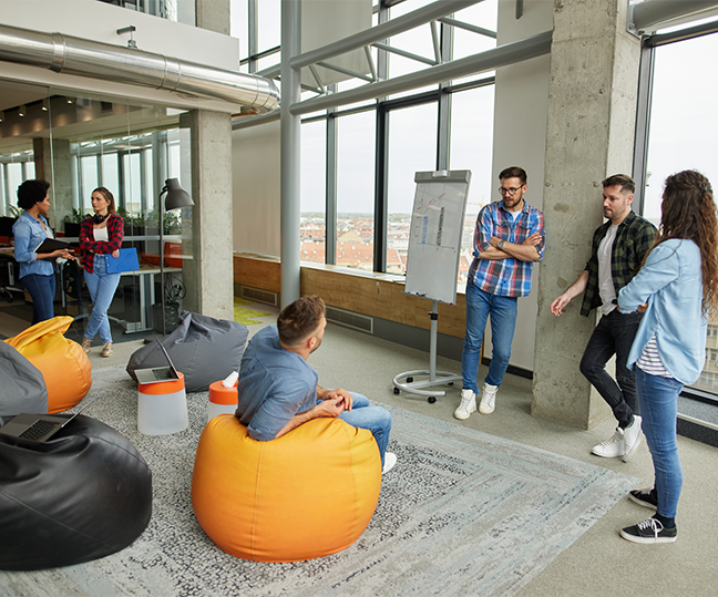 IT team discussing web design and seo packages in office