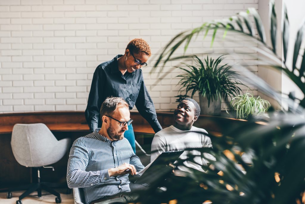 Multi-ethnic small team of digital marketing specialists.